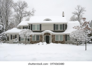 Suburban Home Photographed In The Winter After A Snowstorm. Seasonal. 