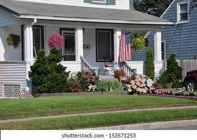 Suburban Home Porch Front Yard American Flag Flowers