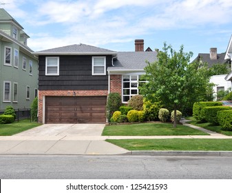 Suburban House Landscaped front yard lawn Residential Neighborhood USA Blue Sky Clouds