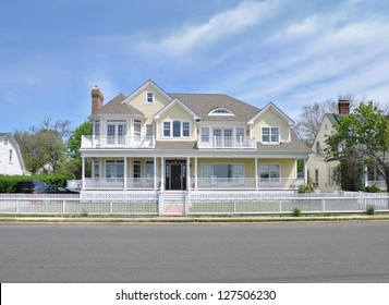 Suburban McMansion Yellow House Sunny Day