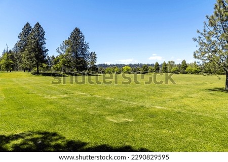 The suburban Mirabeau Point Park in Spokane Valley, Washington, USA on a summer day.	