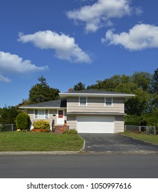 Suburban Split Level Home Blue Sky Clouds USA