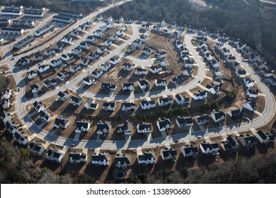 Suburban Sprawl Housing Track In Late Afternoon Light.