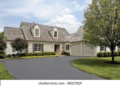 Suburban Stone Home With Cedar Shake Roof