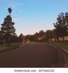 Suburban Street In Australia At Sunset. Quiet Road With Residential Houses In An Australian Suburb. Hazelbrook, Blue Mountains, Australia.