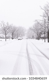 Suburban Street Covered In Heavy Winter Snow