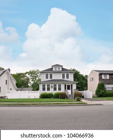 Suburban Two Story Home With American Flags Residential Neighborhood Street