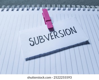 Subversion writting on paper background.