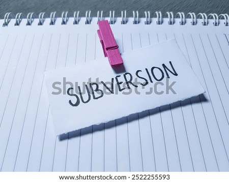 Subversion writting on paper background.