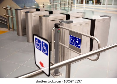 Subway barriers with entrance for physically disabled people and women with baby strollers. - Shutterstock ID 1805945137