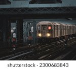 subway car entering the station, belonging to line 1 that serves users of the Bronx, with a slight silhouette of the driver who is in control