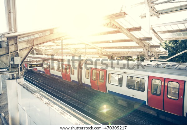 Subway\
car staying on the one of the platforms in\
London