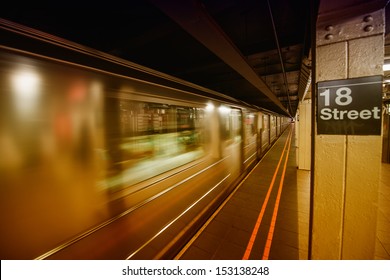 Subway in New York City. 18 st station with speeding up train.