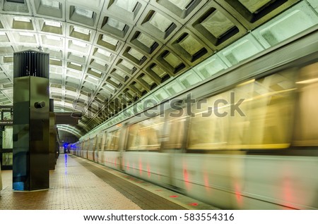 Subway Train Leaving a Deserted Station. Blurred Motion.