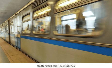 Subway train moving fast through a station, motion blur capturing speed and transit