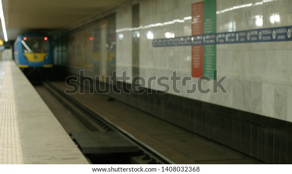 Subway train\
moving on a subway station. Blurred image of underground train\
arriving at modern subway\
station.