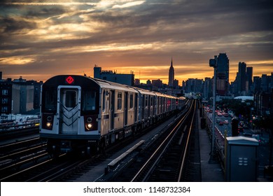 Subway train in New York at sunset and Manhattan cityscape view