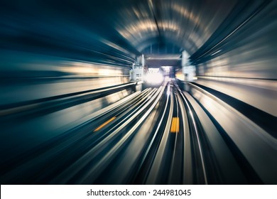 Subway tunnel with blurred light tracks with arriving train in the opposite direction - Concept of modern metro underground transport and connection speed