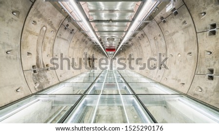 Subway tunnel walkway with no people. Public transportation, construction industry, civil engineering, city life, or futuristic interior design concept