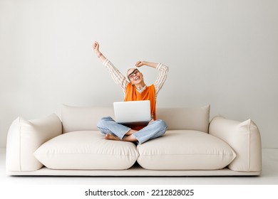 Success And Achievement. Overjoyed Woman Freelancer With   Short Hair In Glasses  Rejoices    With Excitement, Feeling Excited After Receiving Job Offer By Email Or Exam Result While  During Work  