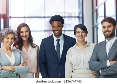 Success Built On Diversity And Ambition. Portrait Of A Diverse Team Of Professionals Standing Together In A Modern Office.