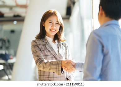 success business people shake hands. - Shutterstock ID 2111590115