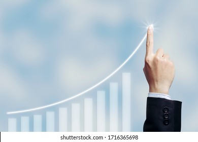 Success Businessman With Business Growing Graph Growing Virtual Hologram Of Statistics, Graph With Arrow Up On White Cloud  Background. Stock Market. Business Growth, Planing And Strategy Concept.