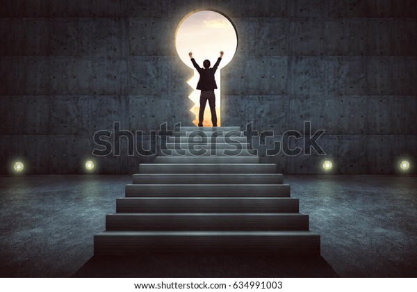 Success\
businessman cheering on stair against concrete wall with key hole\
door ,sunrise scene city skyline outdoor view\
.