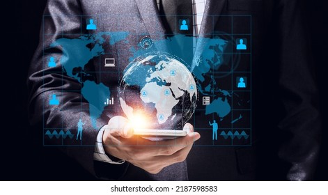 Success Businessman ues smartphone digital technology link internet connection network earth global financial world banking.hologram icon and business world success technology on black background
