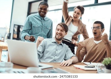 Success, creative team and celebration in office for achievement, promotion and winning with laptop. Diversity, people and excited at desk for wow, bonus and collaboration in modern workplace