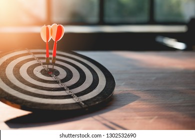 The success is due to the collaboration of a team of business people who are taking towards the goal, Darts rush lace go to target. - Shutterstock ID 1302532690