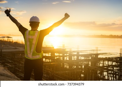 Success Engineer Or Safety Officer Holding Hard Hat  In Construction Site.