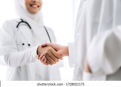 Success Of Handshake Two Muslim Asian Female Doctor In Hospital.healthcare And Medicine