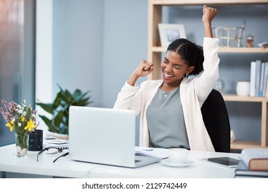 Success Happens When You Combine Passion With Ambition. Shot Of A Happy Young Businesswoman Celebrating At Her Desk In A Modern Office.