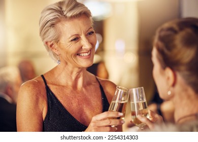 Success, happy or women toast in a party for goals, winning or new year at luxury social event. Mature, celebration or senior friends cheers with champagne drinks or wine glasses at a fun dinner gala - Powered by Shutterstock