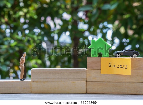 success life concept -\
close up business people work for success to own house and car\
steps by steps 