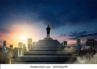 Success Person Climbed On Top Of The Stairs Looking At The Cityscape. Success Business Concept.