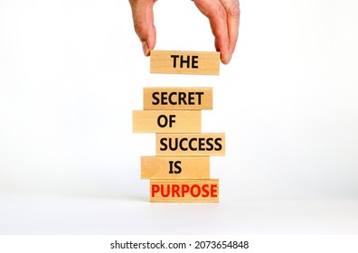 Success and purpose symbol. Wooden blocks with concept words The secret of success is purpose. Beautiful white background, copy space. Businessman hand. Business, success and purpose concept. - Shutterstock ID 2073654848