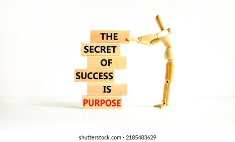 Success and purpose symbol. Wooden blocks with concept words The secret of success is purpose. Beautiful white background, copy space. Businessman model. Business, success and purpose concept. - Shutterstock ID 2185483629