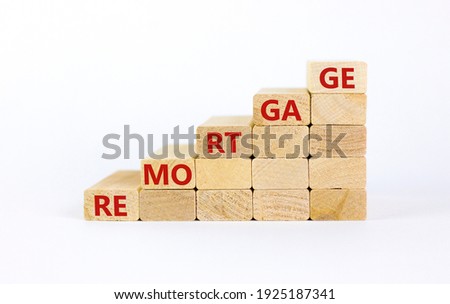 Success remortgage process symbol. Wooden cubes stacking as step stair on white background, copy space. Word 'remortgage'. Business and remortgage concept.