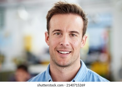 Success Is A Smile Away. Portrait Of Smiling Man In A Casual Work Environment.