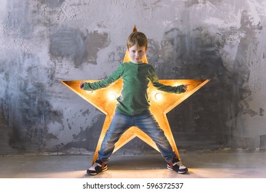 success star boy, kid with a star light in a loft interior