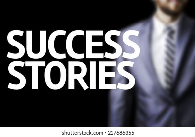 Success Stories Written On A Board With A Business Man On Background