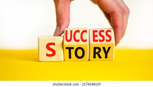 Success Story Symbol. Concept Words Success Story On Wooden Cubes. Businessman Hand. Beautiful Yellow Table White Background. Business And Success Story Concept. Copy Space.