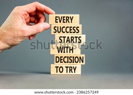 Success symbol. Concept words Every success starts with decision to try on wooden block. Beautiful grey table background. Businessman hand. Business success and decision to try concept. Copy space.
