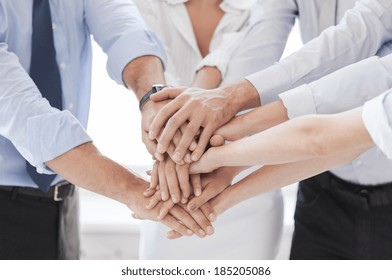 success and winning concept - happy business team celebrating victory in office - Shutterstock ID 185205086