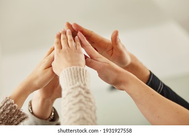 success and winning concept - happy business team giving high five in office - Shutterstock ID 1931927558