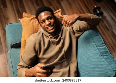 Successful African American graphic designer, using his laptop and creative skills to design logos, websites, and other digital media. - Powered by Shutterstock