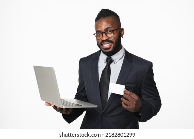 Successful African Businessman Ceo Leader Boss Bank Manager Showing Credit Card For E-banking E-commerce With Laptop Isolated In White Background