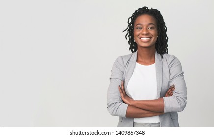 Successful African Businesswoman With Arms Crossed On Grey Background, Free Space